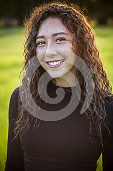 Portrait of a beautiful young hispanic teen girl outdoors