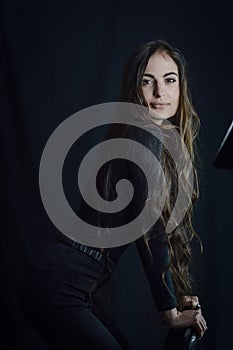 Portrait of a beautiful young Italian woman with very long hair smiling tenderly
