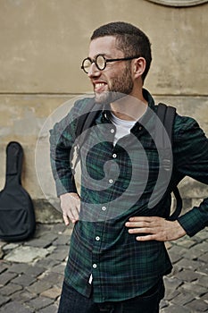 Portrait of beautiful young man in classic round glasses