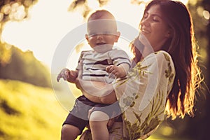 Portrait of beautiful young mother and her baby boy.