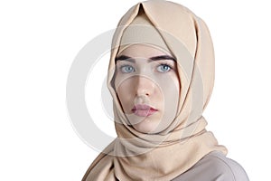 Portrait of a beautiful young muslim woman in hijab on isolated white background