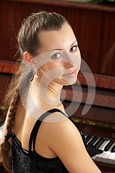 Portrait of beautiful young pianist photo