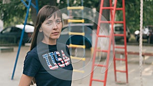 Portrait of beautiful young pretty woman with national usa flag on t-shirt