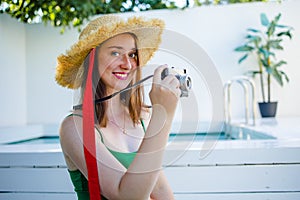 Portrait beautiful young red hair woman relax smile leisure around outdoor swimming pool nearly sea beach ocean for holiday vacati