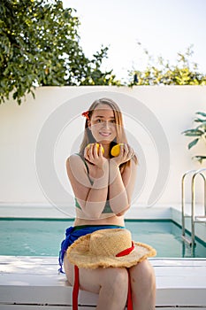 Portrait beautiful young red hair woman relax smile leisure around outdoor swimming pool nearly sea beach ocean for holiday vacati