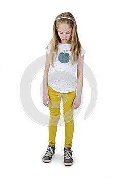 Portrait of a beautiful young sad girl. Full length. Isolated on white background.