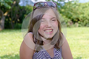 Portrait of beautiful young smiling teen girl, outdoor