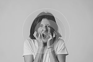 Portrait of a beautiful young woman with angry face looking furious. Human expressions and emotions