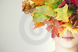 Portrait of a beautiful young woman in autumn