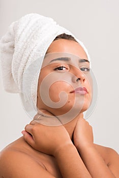 Portrait of a beautiful young woman in a bathroom.