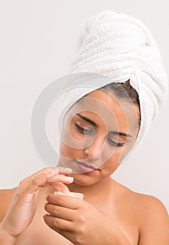 Portrait of a beautiful young woman in a bathroom.