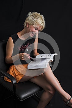 Portrait of beautiful young woman on black background