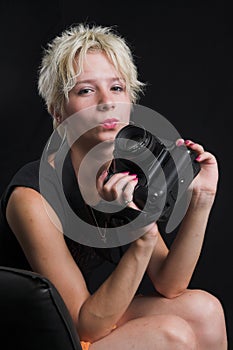 Portrait of beautiful young woman on black background