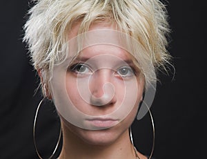 Portrait of beautiful young woman on black background