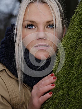 Portrait of a beautiful young woman with blue eyes and blond hair