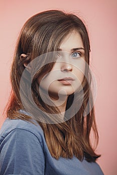 Portrait of a beautiful young woman with blue eyes on studio background, face of girl with natural beauty, concept people