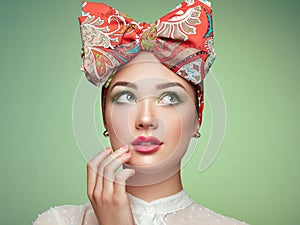 Portrait of beautiful young woman with bow