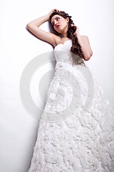 Portrait of beautiful young woman bride in white Wedding Dress