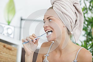 portrait beautiful young woman brushing teeth