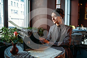 Portrait of beautiful young woman in cafe