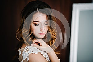 Portrait of a beautiful young woman. Closed eyes. Makeup and hairstyle in bride. Close up. Wedding morning. Gentle, Tender emotion