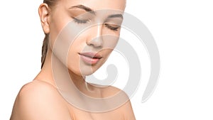 Portrait of beautiful young woman with closed eyes. Pure, natural skin. Isolated on white. Skin care, feminity and woman