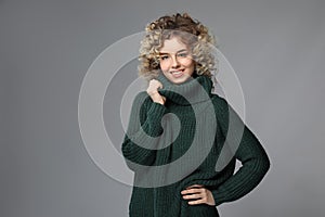 Portrait of beautiful young woman on color background