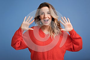 Portrait of beautiful young woman on color background