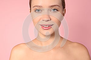 Portrait of beautiful young woman on color background. Lips contouring, skin care