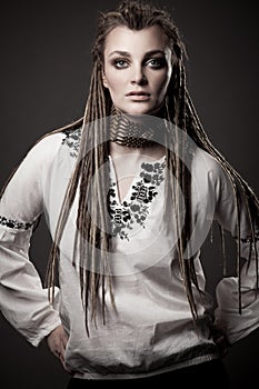 Portrait of a beautiful young woman with dreadlock photo