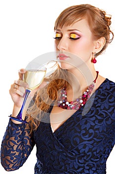 Portrait of a beautiful young woman with a glass of champagne