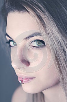 Portrait of beautiful young woman with green eyes