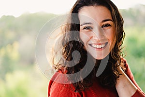 Portrait of a beautiful young woman with a healthy smile outdoor