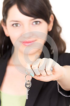 Portrait of beautiful young woman holding key