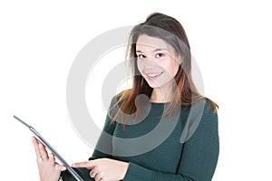 Portrait of beautiful young woman joyful reading something on electronic tablet computer in white studio background