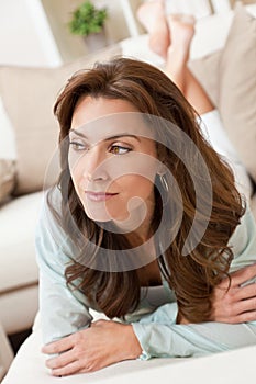 Portrait of A Beautiful Young Woman Laying on a Sofa