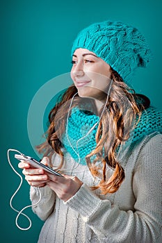 Portrait of a beautiful young woman listening to music