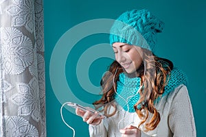 portrait of a beautiful young woman listening to music on headphones