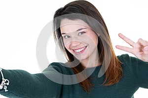 Portrait of a beautiful young woman make selfie with phone