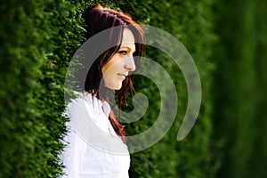 Portrait of a beautiful young woman outdoors