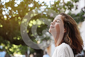 Portrait of beautiful young woman outdoors. Space for text