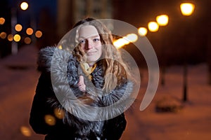 Portrait of beautiful young woman outside