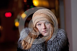 Portrait of beautiful young woman outside