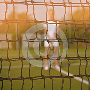 Portrait of beautiful young woman playing paddle tennis.