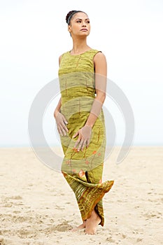 Portrait of a beautiful young woman posing at the beach