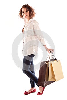 Portrait of a beautiful young woman posing with shopping