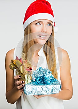 Portrait of beautiful young woman with presents