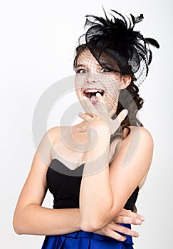 Portrait of a beautiful young woman in retro funy hat