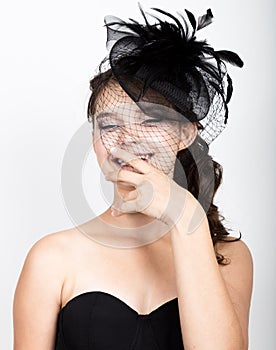 Portrait of a beautiful young woman in retro funy hat