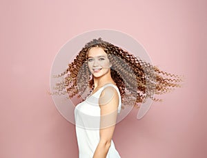 Portrait of beautiful young woman with shiny wavy hair